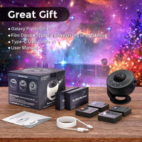 Galaxy projector set with film discs, USB cable, and user manual on a wooden surface with a festive background.